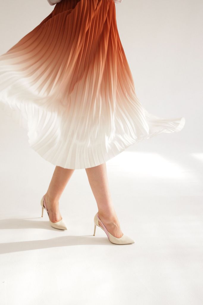 Close view of a pleated skirt in motion